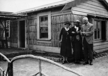 Image: Te Kirihaehae Te Puea Hērangi, and two others, outside a Land Development Scheme house