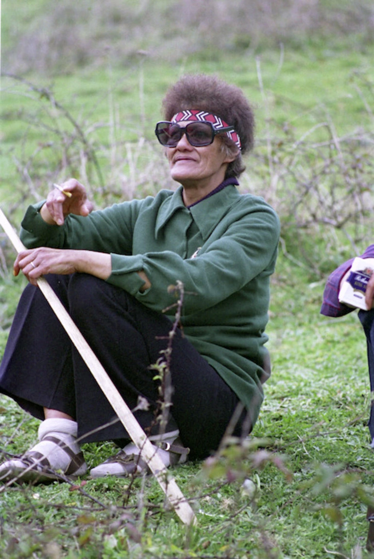 Image: Female Maori participant in Maori Land March sitting on grass at Whakapapa Picnic, Whangarei