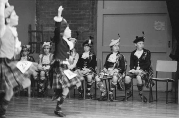 Image: Scene during the 10 to 12 year-old highland fling section of a highland dancing competition, Lower Hutt Little Theatre, Wellington region