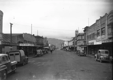 Image: Looking down Jackson Street, Petone, close to Scholes Lane, with R W Short & Co and, a van advertising Madeline Cake Kitchen, on the left and the Quality Cake Kitchen, Davidson's chemist and Macduffs Ltd on the right