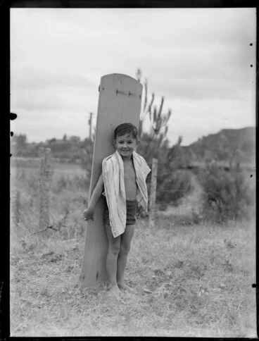 Image: Summer Child Studies series, unidentified boy, with a surfboard
