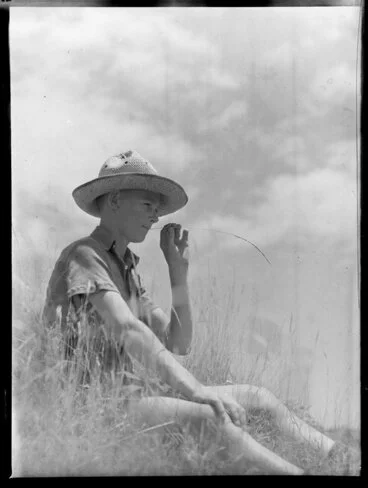Image: Summer Child Studies series, unidentified boy, sitting and chewing grass