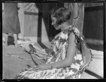 Image: Molly Runga Raukura of Tokaanu dressed in a kahu huruhuru and holding a hei tiki