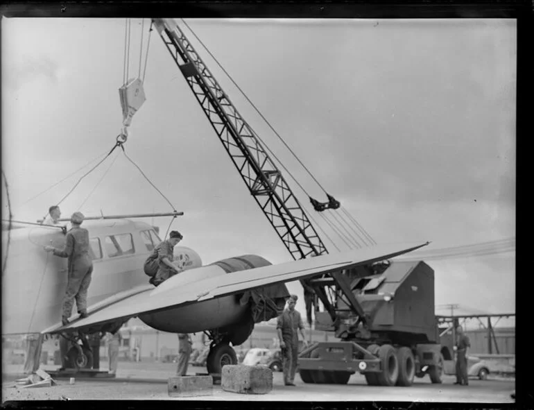 Image: Detaching crane tackle from Cessna aircraft, Kings wharf, Auckland