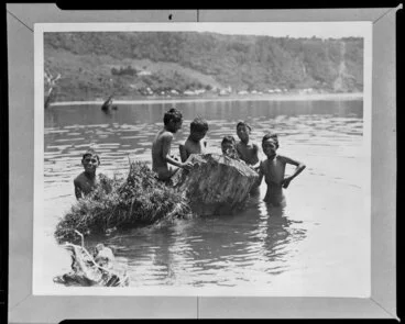 Image: Some Māori boys playing on a tree stump in the river, Lake Taupō