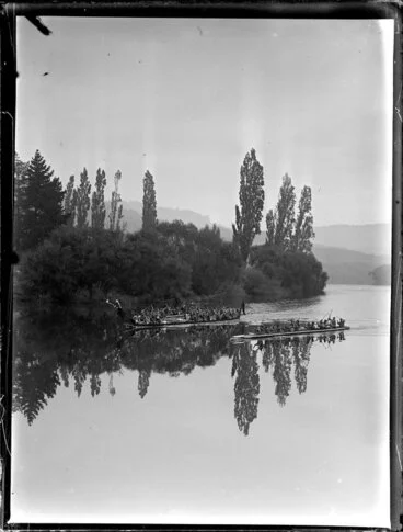 Image: Maori war canoes racing on the river, Waikato