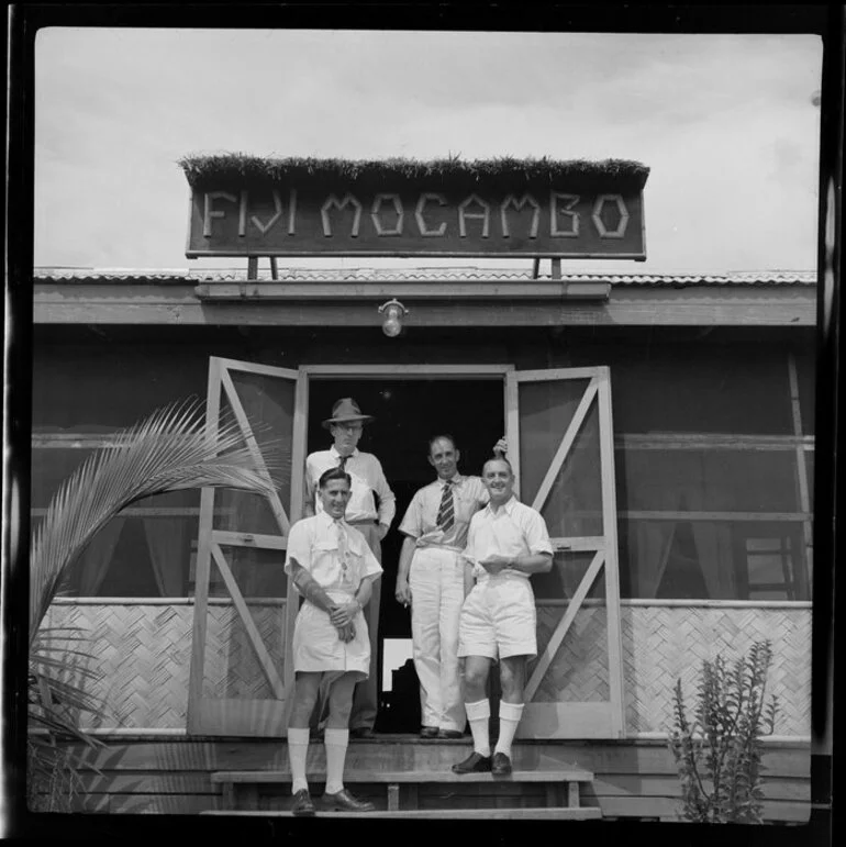 Image: Messrs Lester Guest (Manager, New Zealand National Airways Corporation Hotel), S Brugden (Victoria), T French (Suva) and R A Howlett (Tourist Bureau, Fiji), Nandi Airport, Fiji