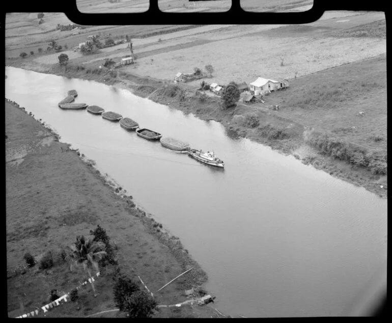 Image: A barge, transporting sugar cane on the Rewa River, Suva, Fiji