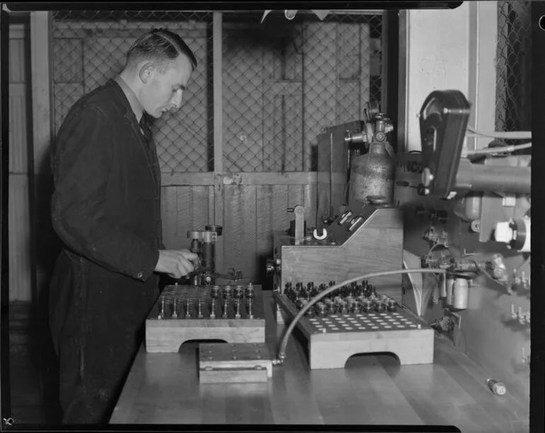 Image: Leading Aircraftman, E Hart at spark plug test bench, Wigram, Christchurch