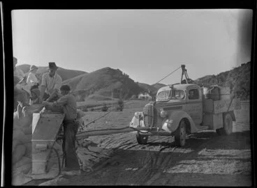 Image: Loading the hopper; Auckland Aviation Services aerial topdressing, Clevedon