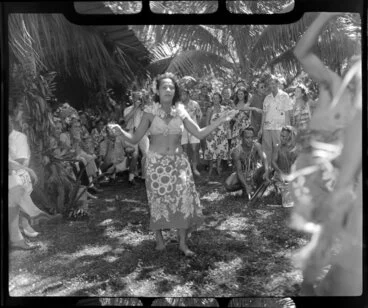 Image: Unidentified local woman, possibly Augustine, performs the hula at a ceremony feast, Tahiti