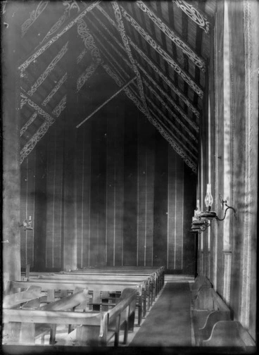 Image: Interior of Te Rangiatea Maori Anglican Church, Otaki, showing the carving and kerosene lamps along the walls, 1887.