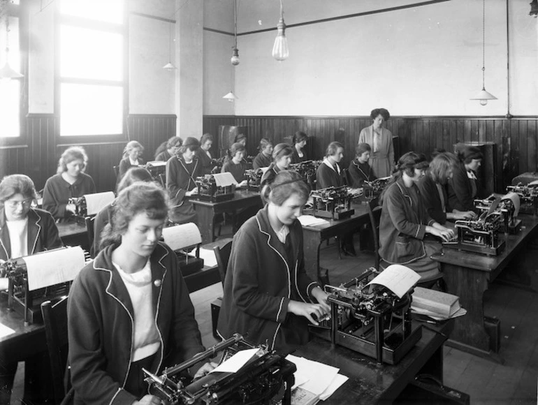 Image: A group of girls, with their tutor, during a typing class at Wanganui Technical College