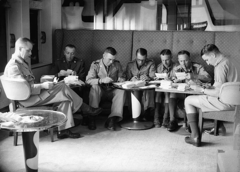 Image: Officers censoring mail, on a troopship bound for the United Kingdom