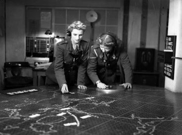 Image: Two members of the Women's Army Auxiliary Corps operating a plotting table