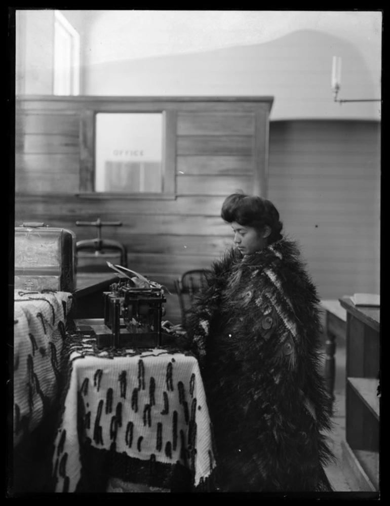 Image: Maori girl with a typewriter