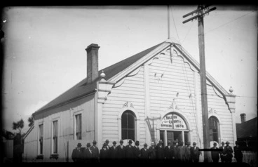 Image: Council offices, Westport, Buller District, showing group of men outside