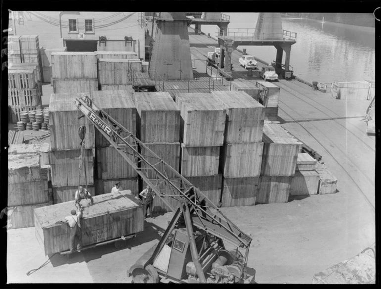 Image: Waterside workers using a crane to lift a crate containing a Vauxhall car, King's Wharf, Wellington