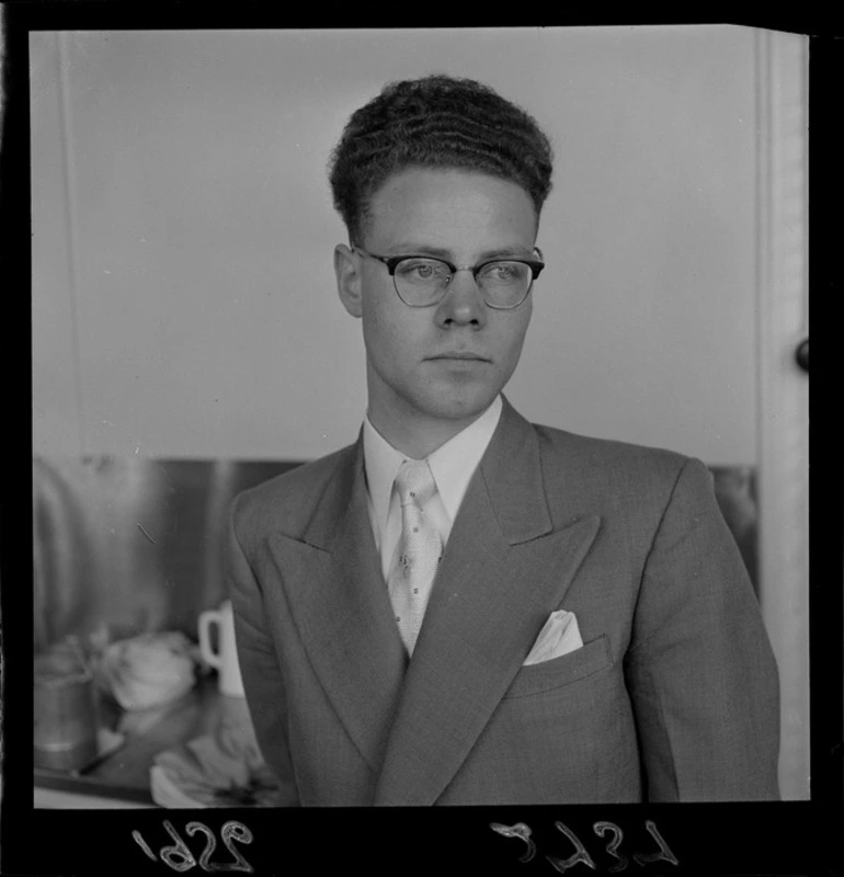 Image: Portrait of Paul Munro wearing glasses and suit