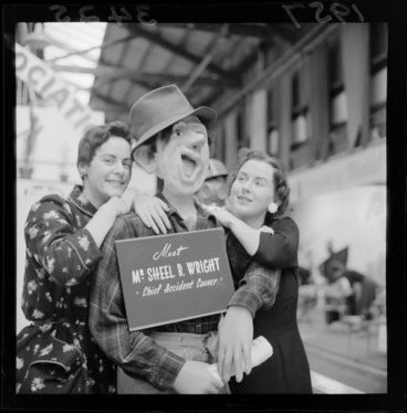 Image: Two unidentified women standing next to a mannequin Mr Sheel B Wright (Chief Accident Causer) at the industries fair, Winter Show Building, Mt Cook, Wellington