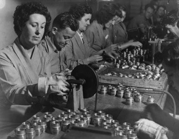 Image: Group at work in a munitions factory during World War 2