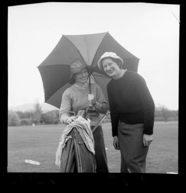 Image: Two women at the Caltex Golf Tournament