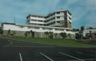 Image: Management Building from parking area below