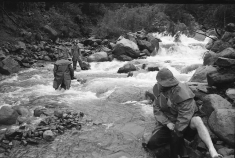 Image: Kaimai air disaster search and rescue volunteers cross a river, 1963
