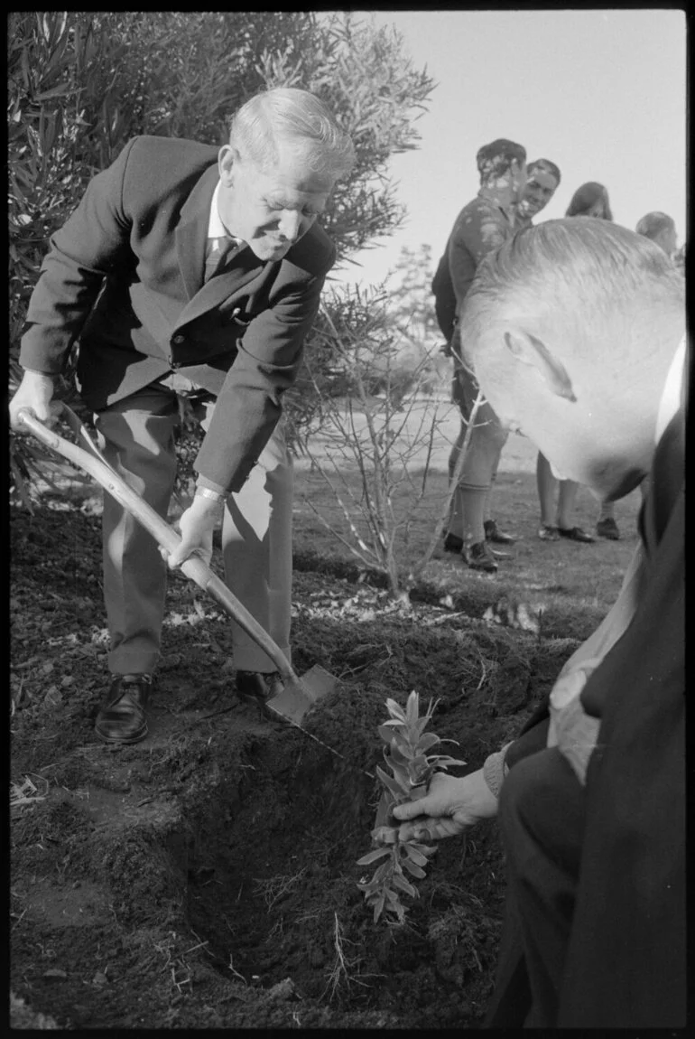 Image: Mr Harris planting tree on Arbor Day