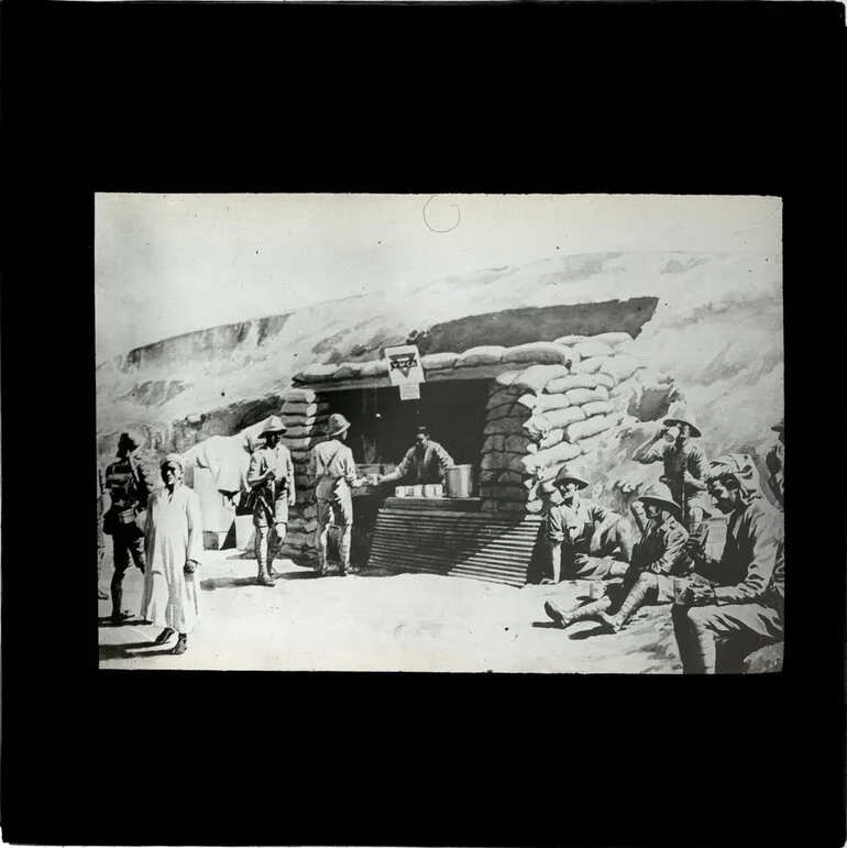 Image: Copy photo of painting of soldiers and locals at sandbagged YMCA Canteen, Palestine
