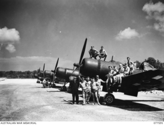 Image: PERSONNEL OF NO. 3 SERVICING UNIT, HEADQUARTERS, ROYAL NEW ZEALAND AIR FORCE POSE FOR THEIR PHOTOGRAPH ON A CHANCE-VOUGHT, "CORSAIR" AIRCRAFT OF NO. 16 SQUADRON, ROYAL NEW ZEALAND AIR FORCE. ..