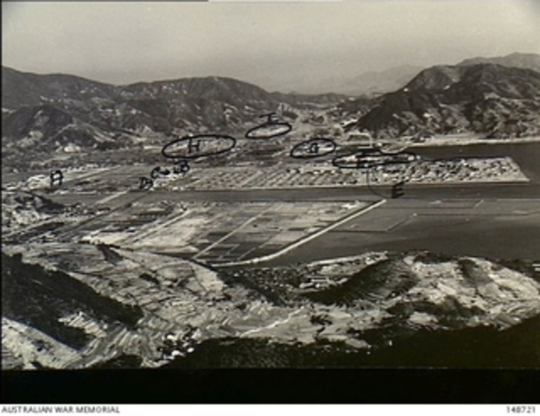 Image: Hiro, Japan. 1953. An elevated view of Allied forces bases in Hiroshima prefecture. Identified are: A. HQ Australian Army Component and 25 Canadian Reinforcement Group area; B. Australian Army ..