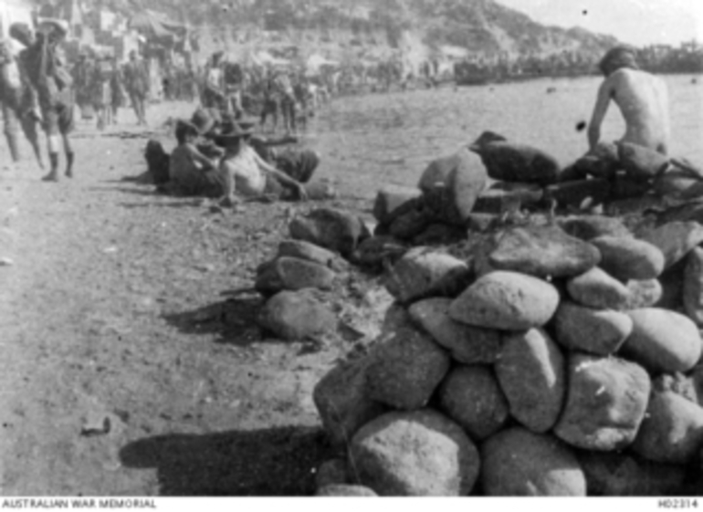 Image: Anzac Cove Beach, Gallipoli. 1915. Members of Anzac Corps on the beach after coming ashore from troopships