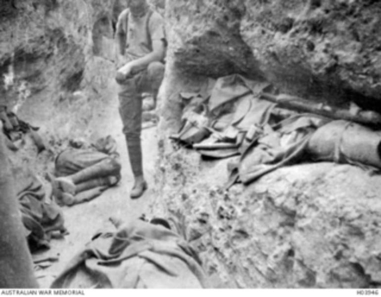 Image: Anzac Area, Gallipoli. 1915. Two Anzac Corps soldiers resting in a communications trench on the right flank of the force