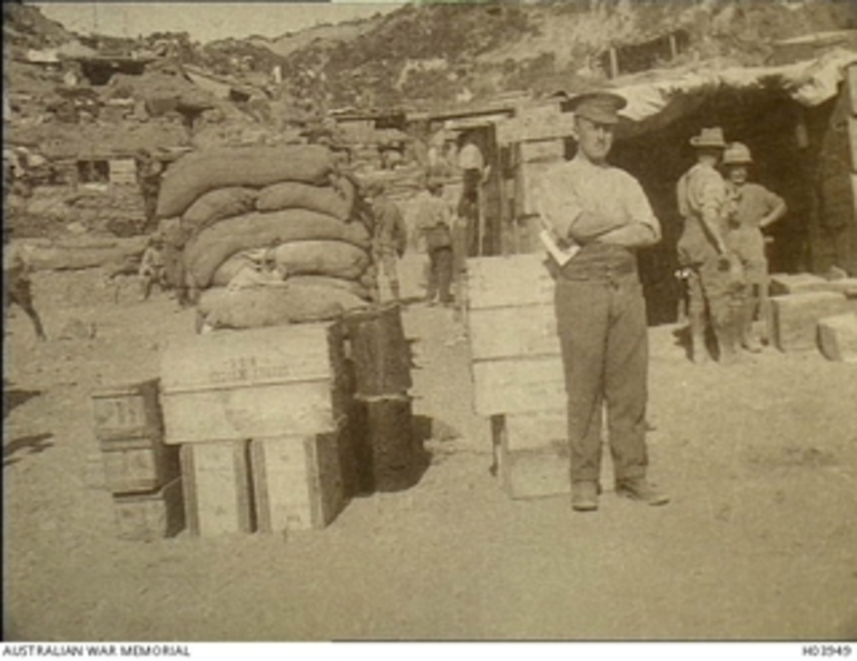 Image: Anzac Beaches Area, Gallipoli. 1915. An Anzac Army Corps supply dump high on a beach at the base of the hills behind the area