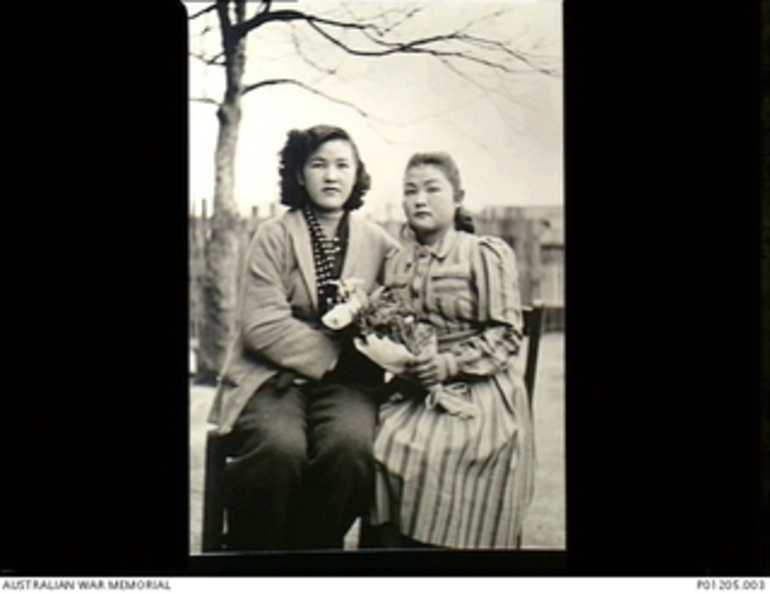 Image: Otake, Japan. 1946-12. Two Japanese housegirls, women civilian employees at the 2nd New Zealand Division Cavalry Regiment Camp. This New Zealand unit was in Japan as part of the British ..