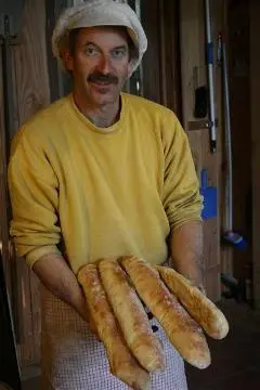 Boly Bolliger holding bread sticks : digital image Image: Boly Bolliger holding bread sticks : digital image