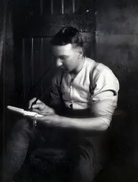 A soldier writing a letter inside : negative Image: A soldier writing a letter inside : negative