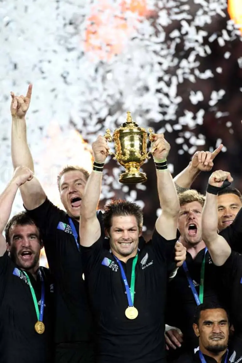 Image: Richie McCaw holds the Webb Ellis trophy