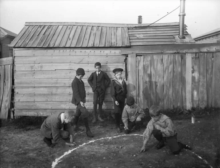 Image: Boys playing marbles, around 1900