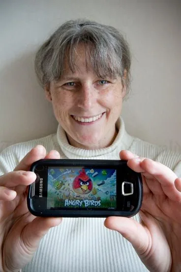 Image: Gaming on a mobile phone, 2011