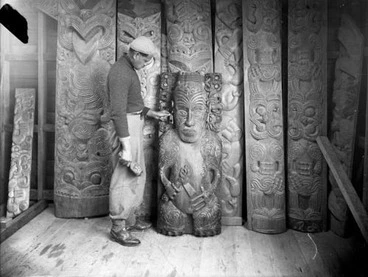 Image: Master wood carver Pineāmine Taiapa with examples of traditional carving