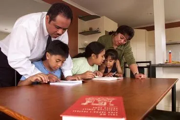 Image: The Aukuso family learning Samoan