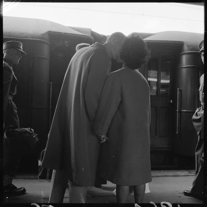 Man and woman kissing at Wellington Railway Station