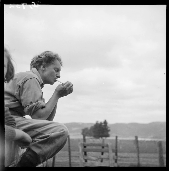 Land girl, Carol Sladden, having a cigarette, Mangaorapa, Hawke's Bay