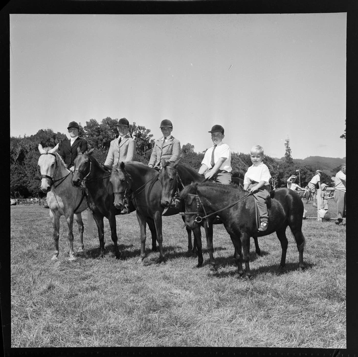 Horse line-up and riders at the 1958 A&P (agricultural and pastoral) show in Trentham, Upper Hutt; includes miniature horse