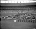 [Teams from Hong Kong, Hungary, Iceland, India, Indonesia, Iran, Ireland, Israel, Italy, Jamaica, Japan, Kenya, Liberia, Luxembourg, Malaya, Mexico, New Zealand, Nigeria, North Borneo, Norway, Pakistan and Peru assembled at the opening ceremony, Olympic Games, Melbourne, 22 November 1956] [picture].