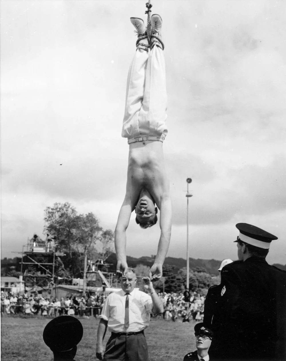 Escapologist at A & P show, Trentham Park 6; lowered from crane.