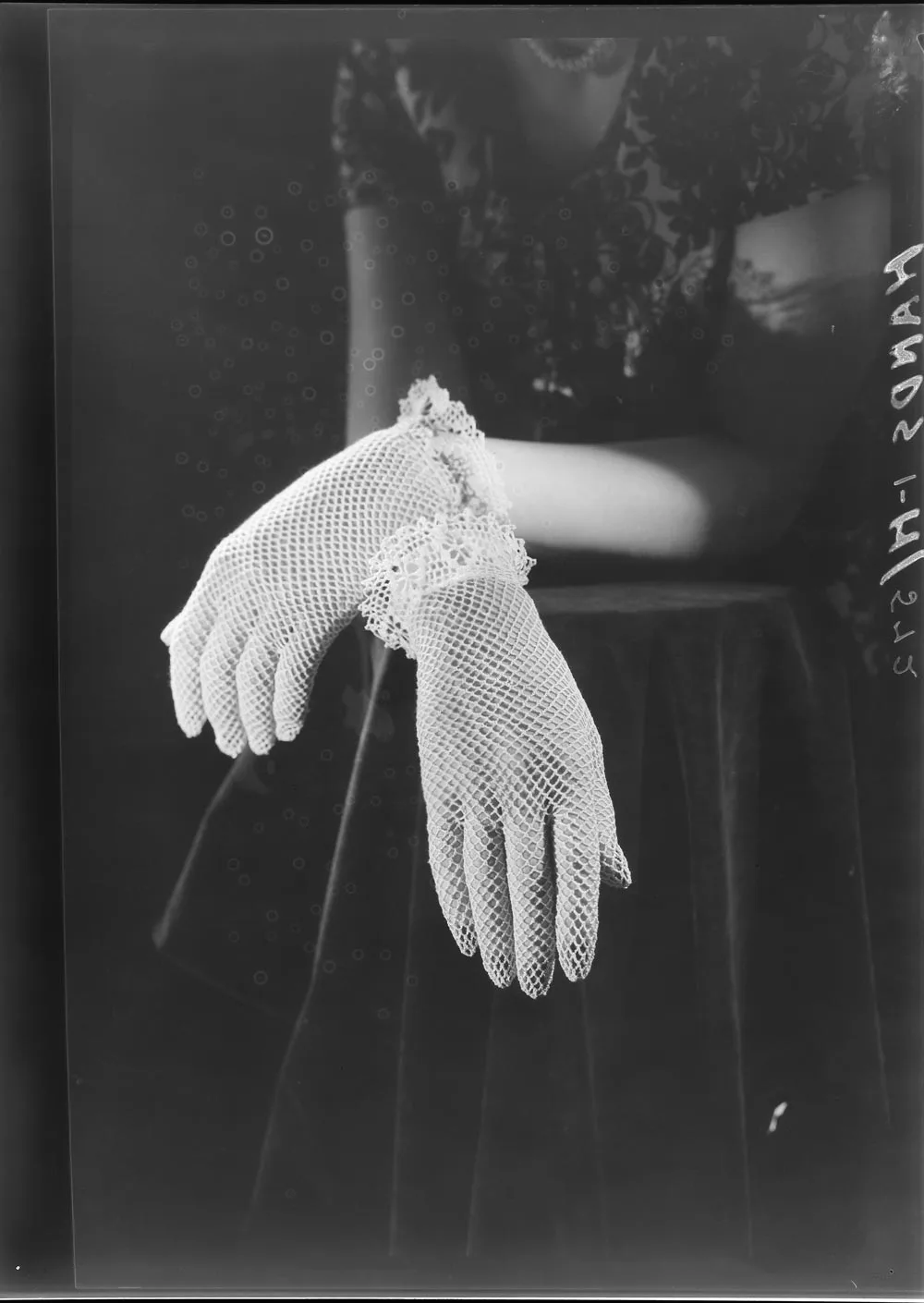 Showing two hands in lace gloves Record DigitalNZ