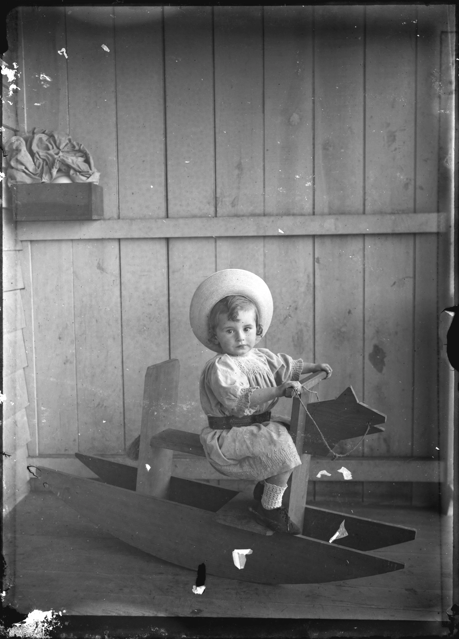 Young child on a rocking horse Record DigitalNZ